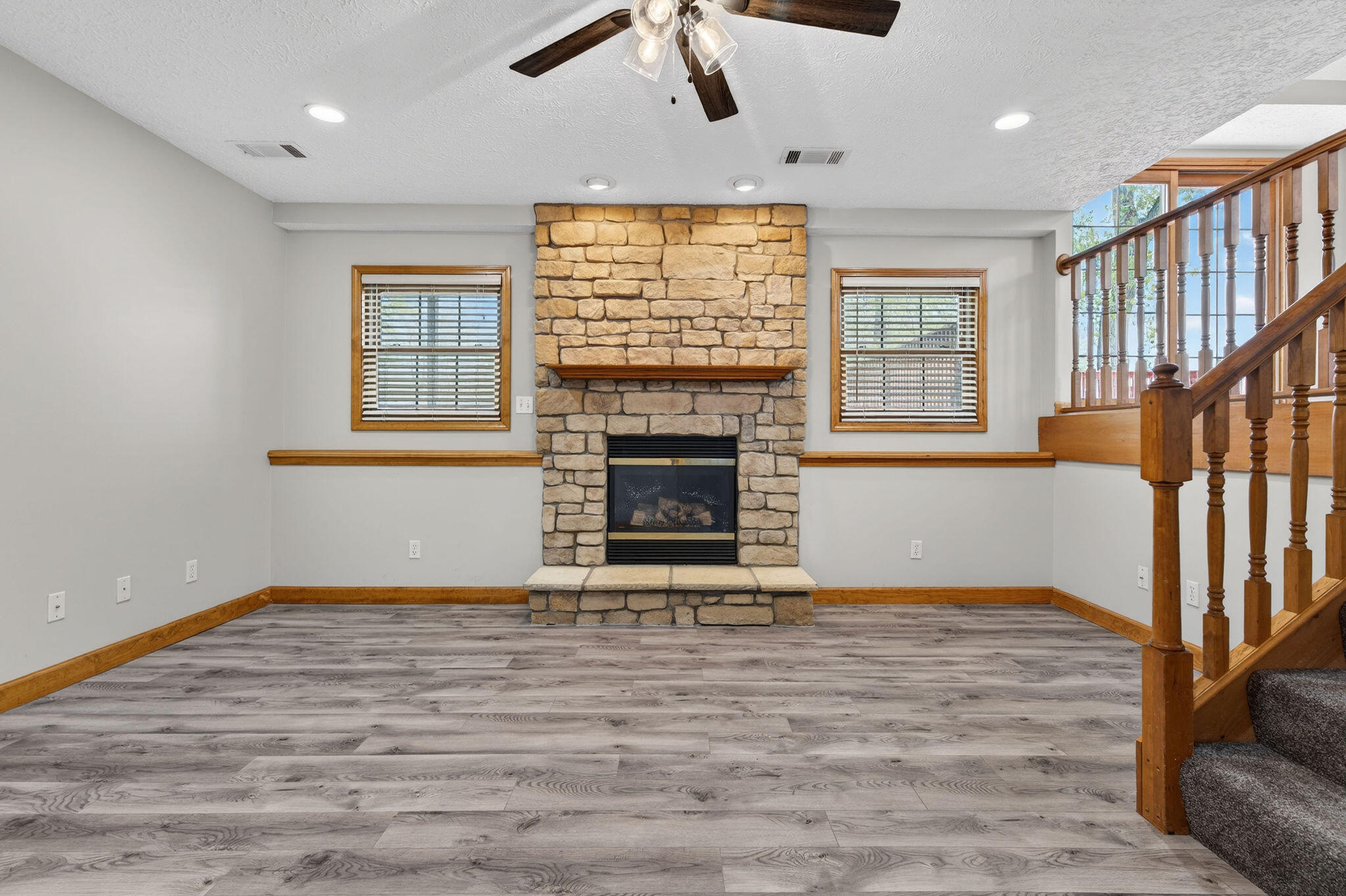 2447 Joseph Avenue Portage, IN 46368 - Photo 27 of 33 wooden floor fireplace and windows in an empty room