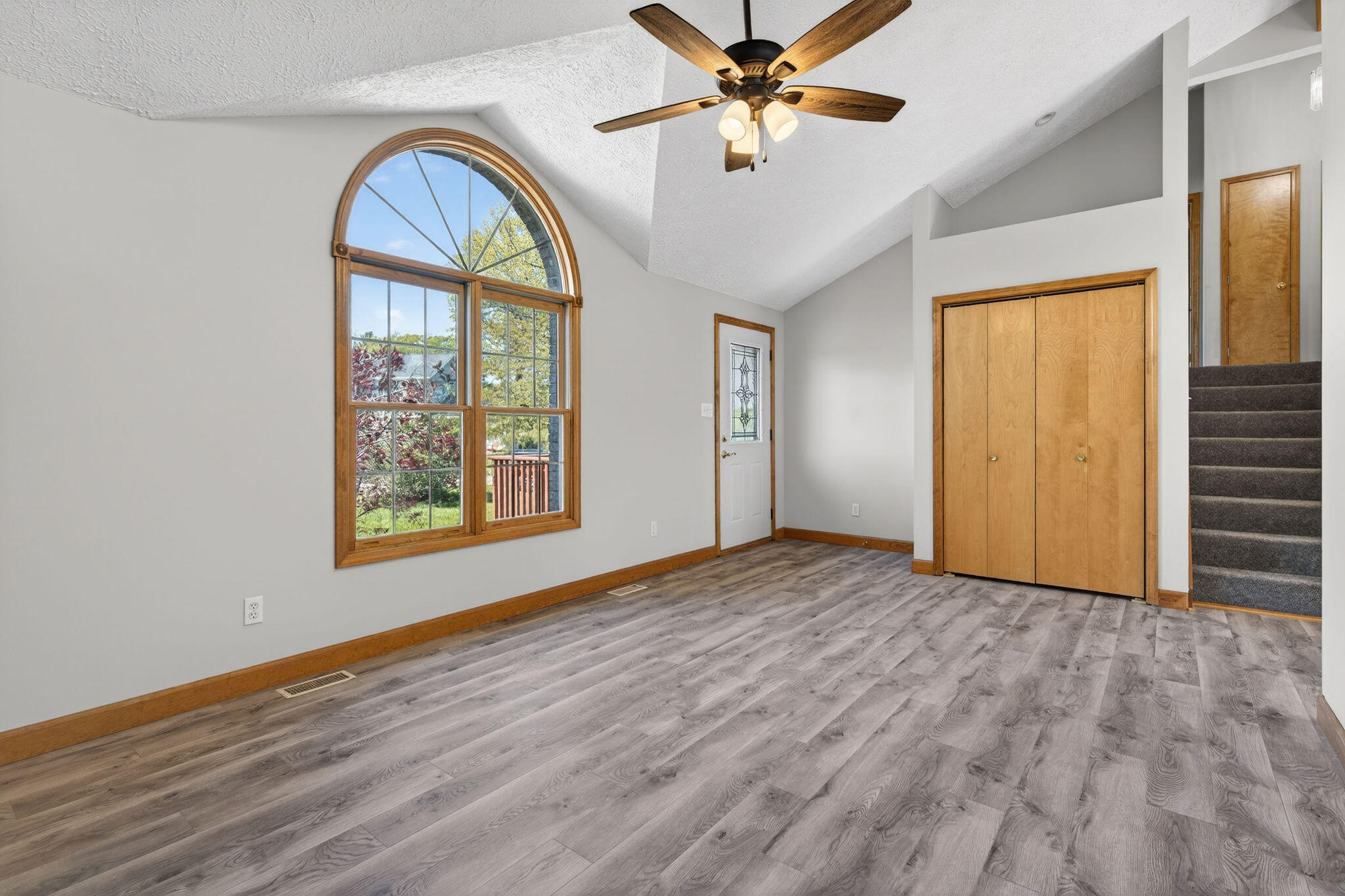 2447 Joseph Avenue Portage, IN 46368 - Photo 3 of 33 a view of an empty room with window and wooden floor