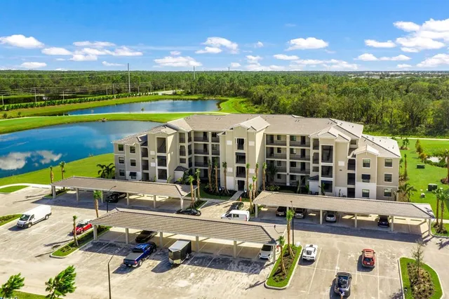 a view of a swimming pool with lounge chairs
