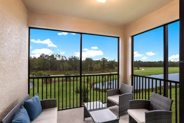 a view of a balcony with wooden floor