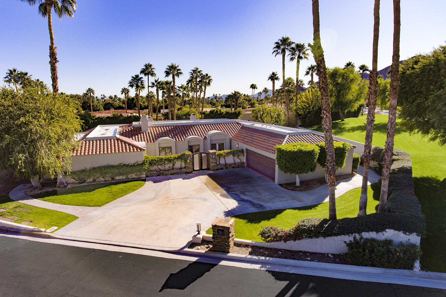4 Boothill Circle Rancho Mirage, CA 92270 - Photo 1 of 55 an aerial view of a house with yard swimming pool and outdoor seating