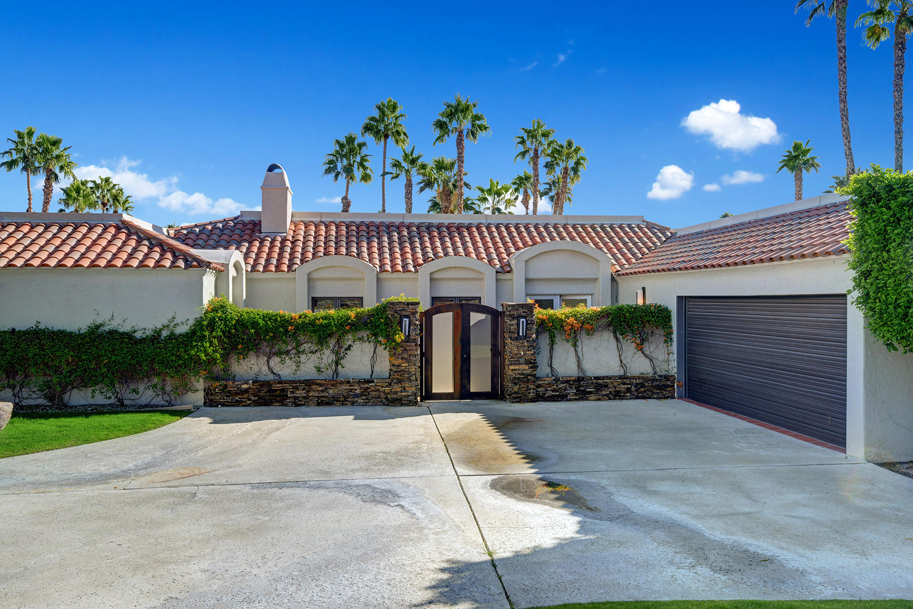 4 Boothill Circle Rancho Mirage, CA 92270 - Photo 12 of 55 a view of a house with a patio