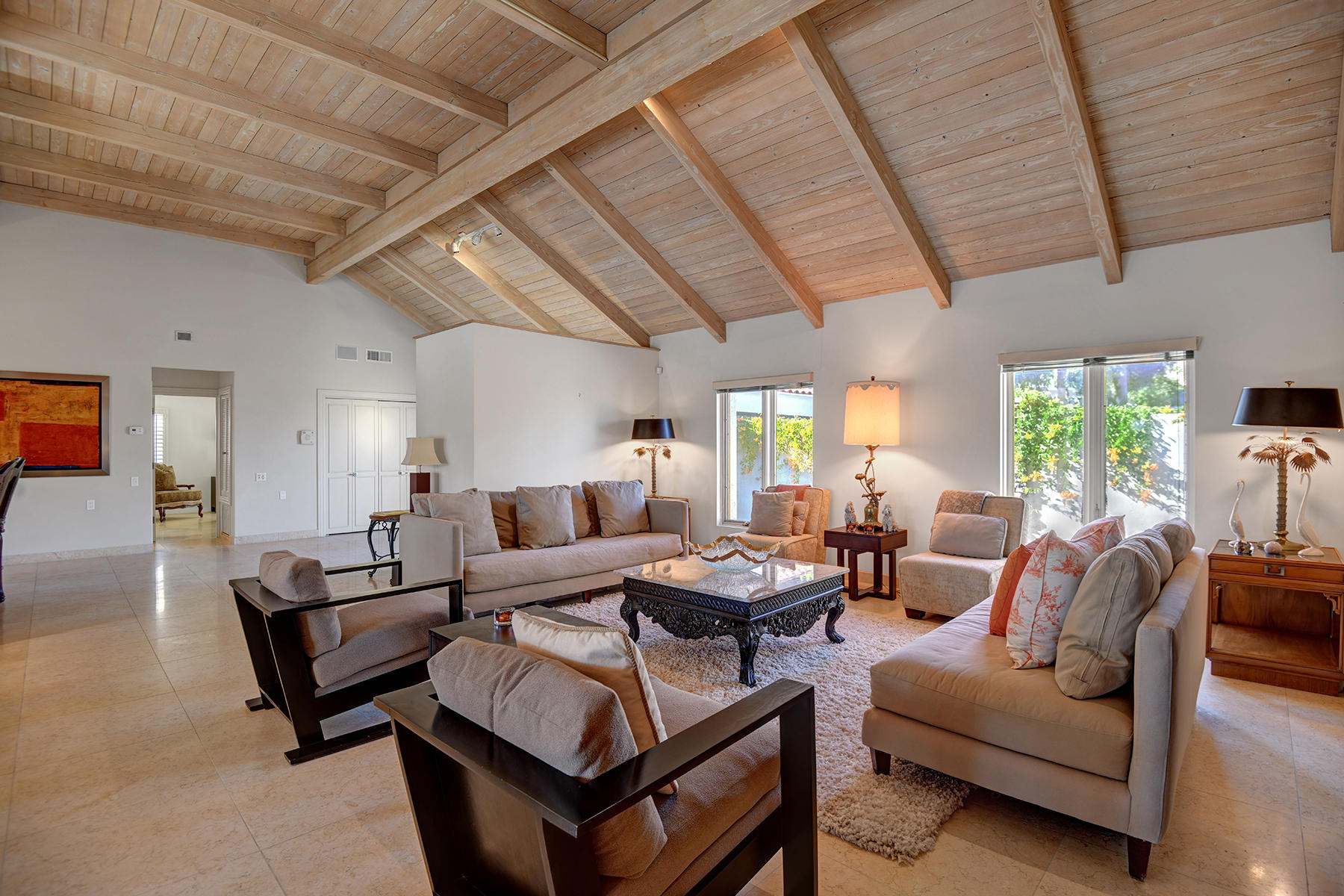 4 Boothill Circle Rancho Mirage, CA 92270 - Photo 21 of 55 a living room with furniture and a large window
