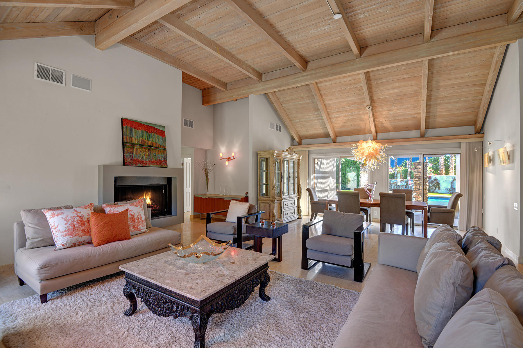 4 Boothill Circle Rancho Mirage, CA 92270 - Photo 22 of 55 a living room with furniture a fireplace and a table