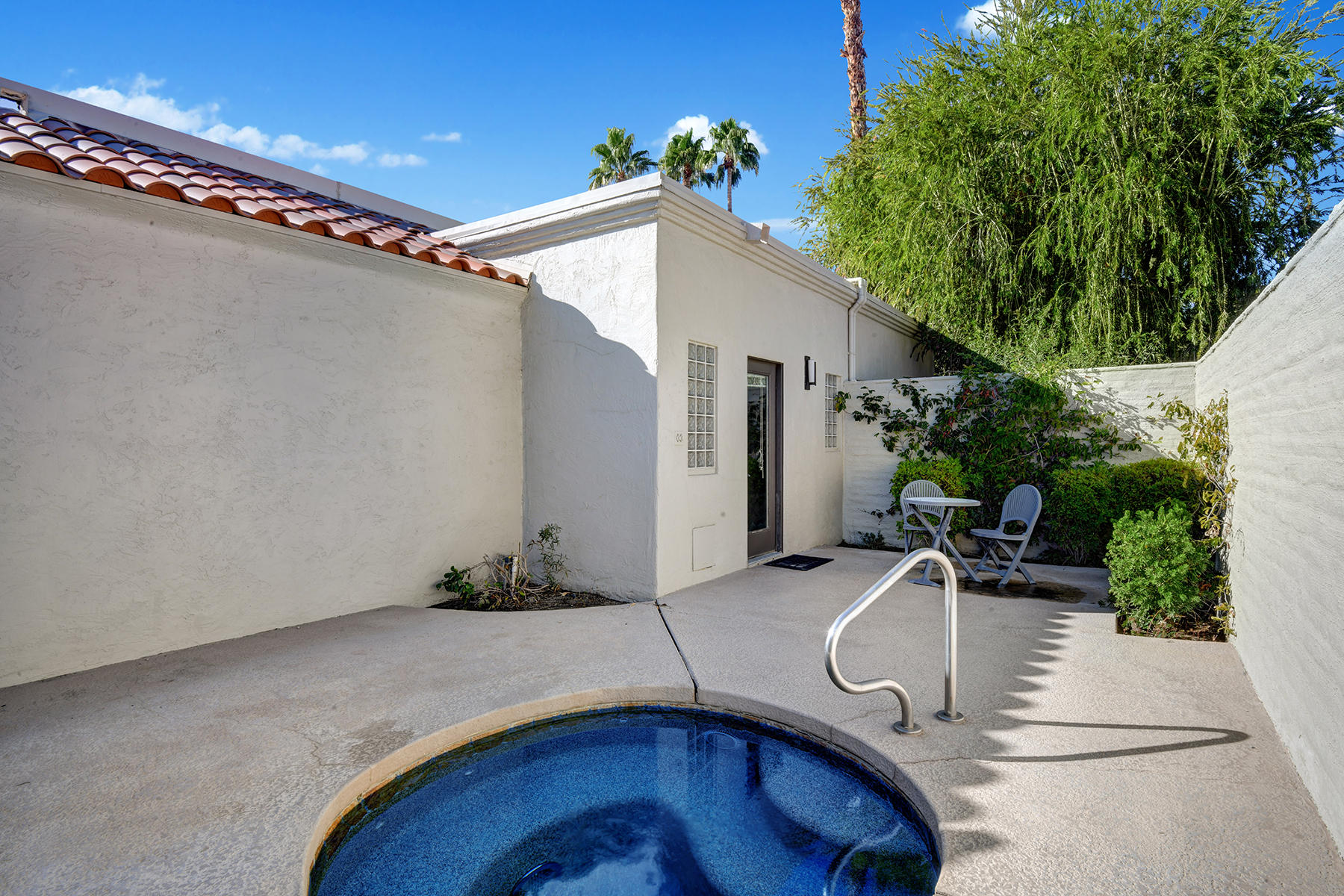 4 Boothill Circle Rancho Mirage, CA 92270 - Photo 35 of 55 a backyard of a house with seating space