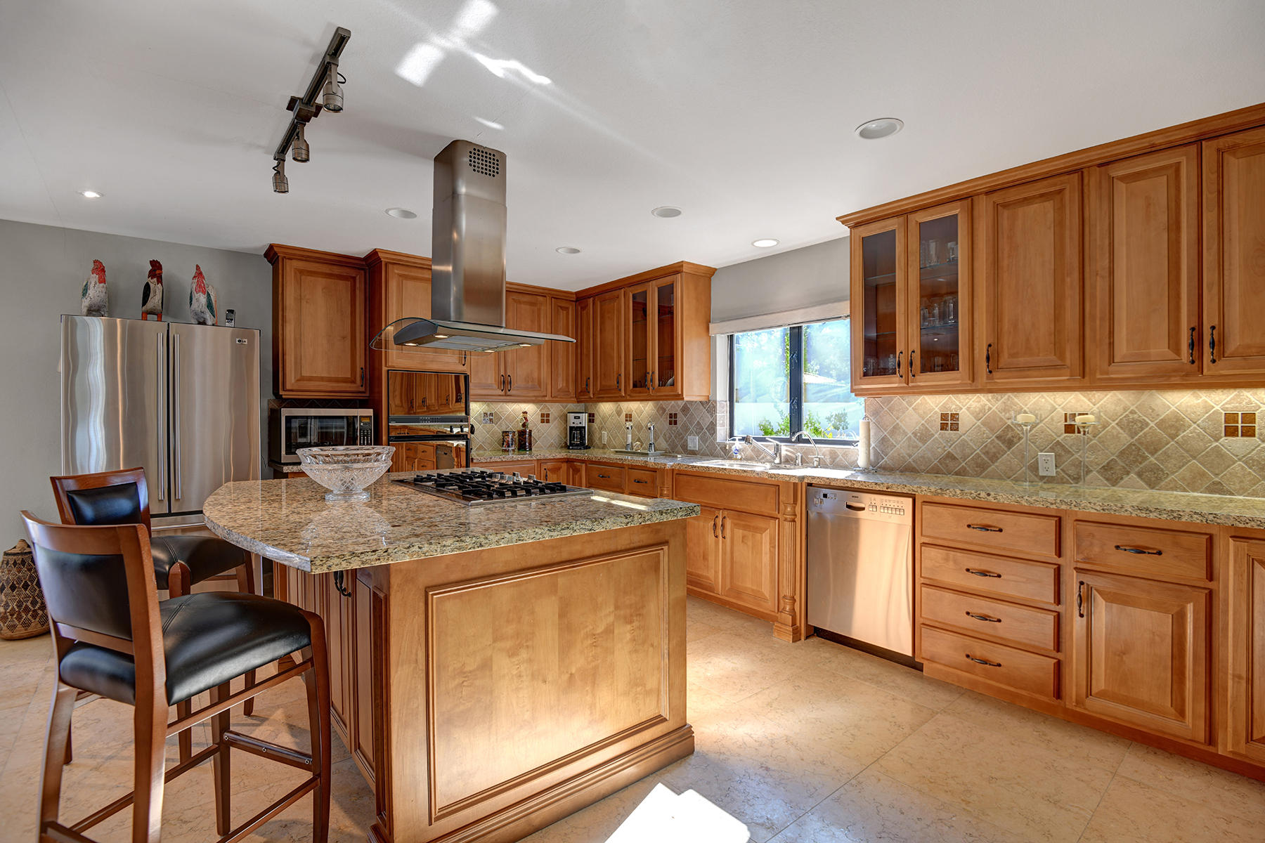 4 Boothill Circle Rancho Mirage, CA 92270 - Photo 44 of 55 a kitchen with stainless steel appliances granite countertop a sink and cabinets