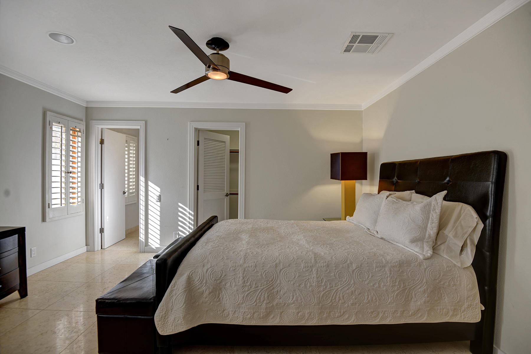 4 Boothill Circle Rancho Mirage, CA 92270 - Photo 48 of 55 a bedroom with a bed and a large mirror