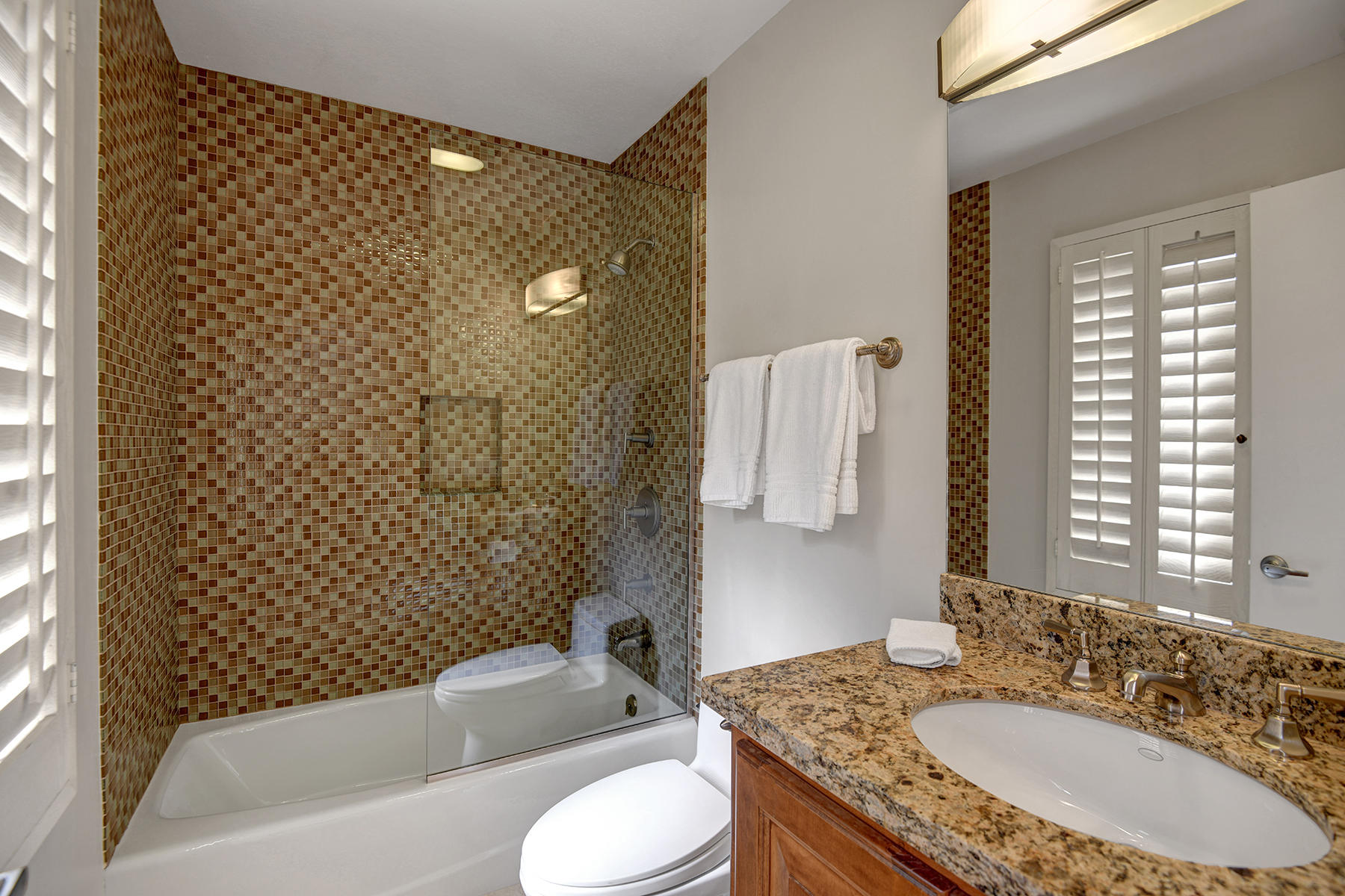 4 Boothill Circle Rancho Mirage, CA 92270 - Photo 49 of 55 a bathroom with a granite countertop sink toilet and shower