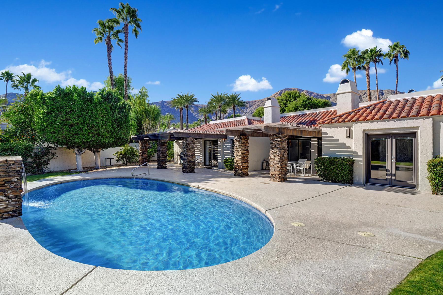 4 Boothill Circle Rancho Mirage, CA 92270 - Photo 6 of 55 a view of a house with swimming pool and sitting area