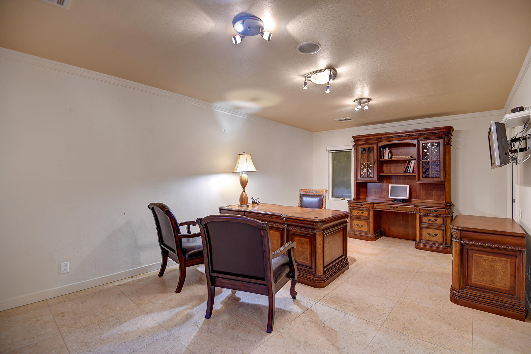 4 Boothill Circle Rancho Mirage, CA 92270 - Photo 51 of 55 a view of a workspace with furniture and chandelier fan