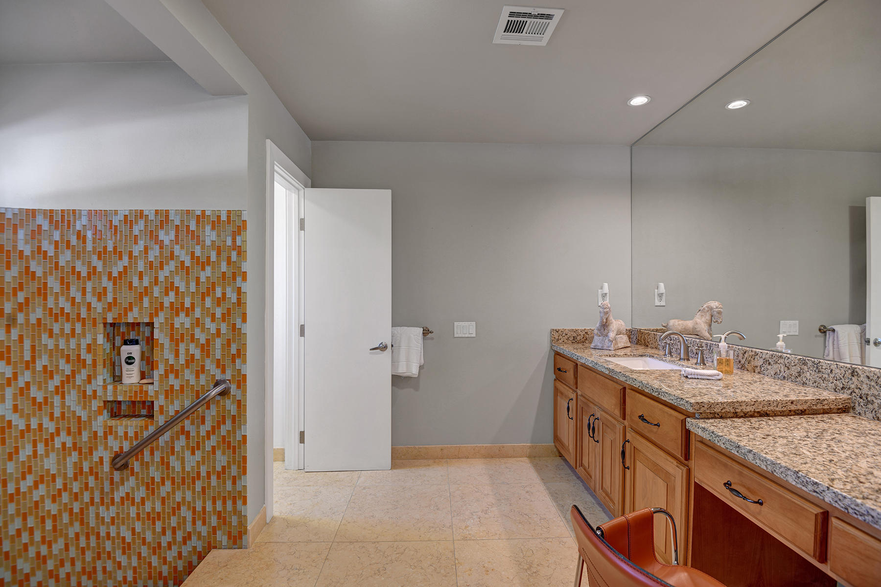 4 Boothill Circle Rancho Mirage, CA 92270 - Photo 53 of 55 a bathroom with a granite countertop sink and a mirror