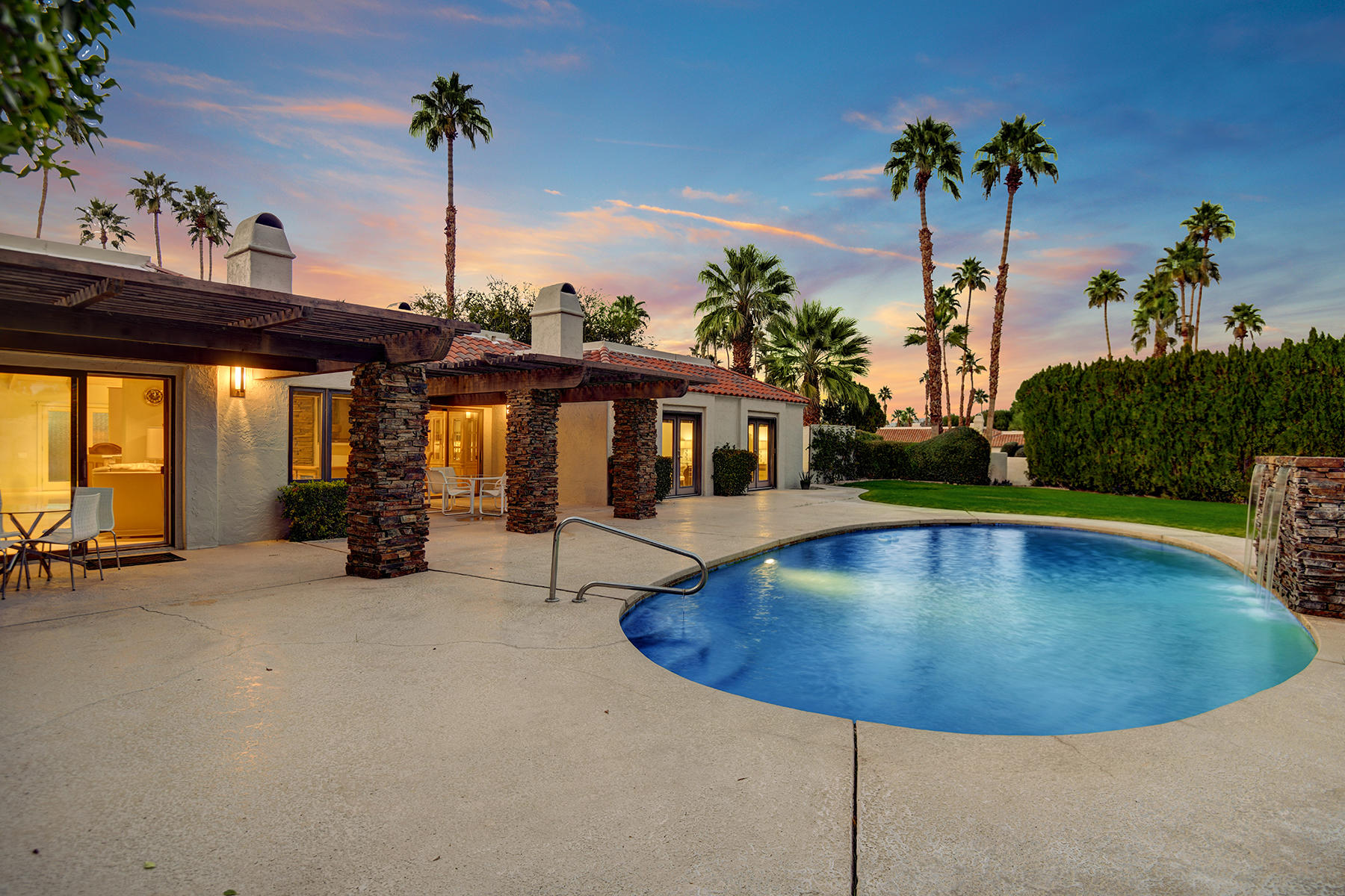 4 Boothill Circle Rancho Mirage, CA 92270 - Photo 7 of 55 an outdoor space with swimming pool and furniture