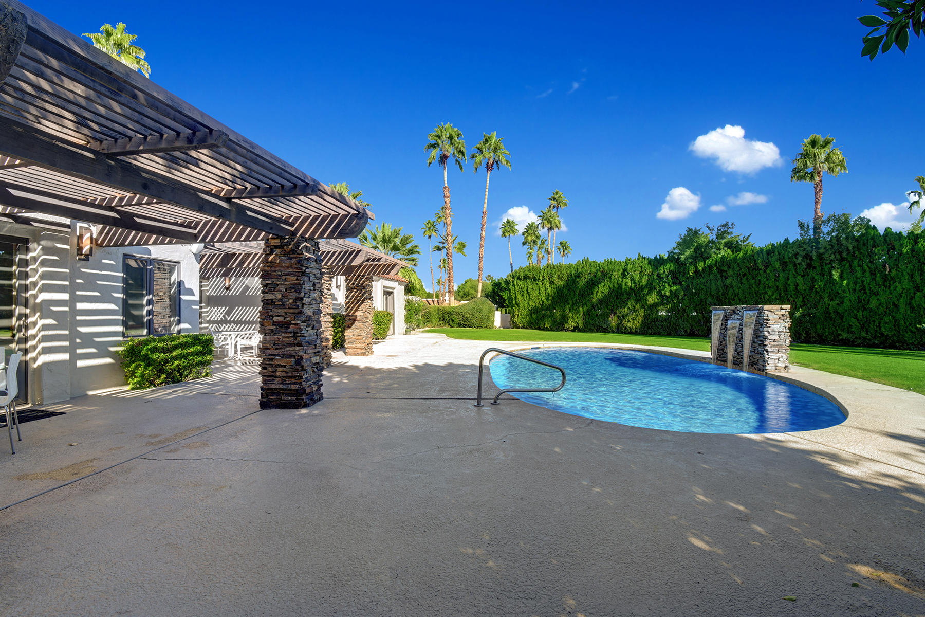 4 Boothill Circle Rancho Mirage, CA 92270 - Photo 8 of 55 a view of a house with a street