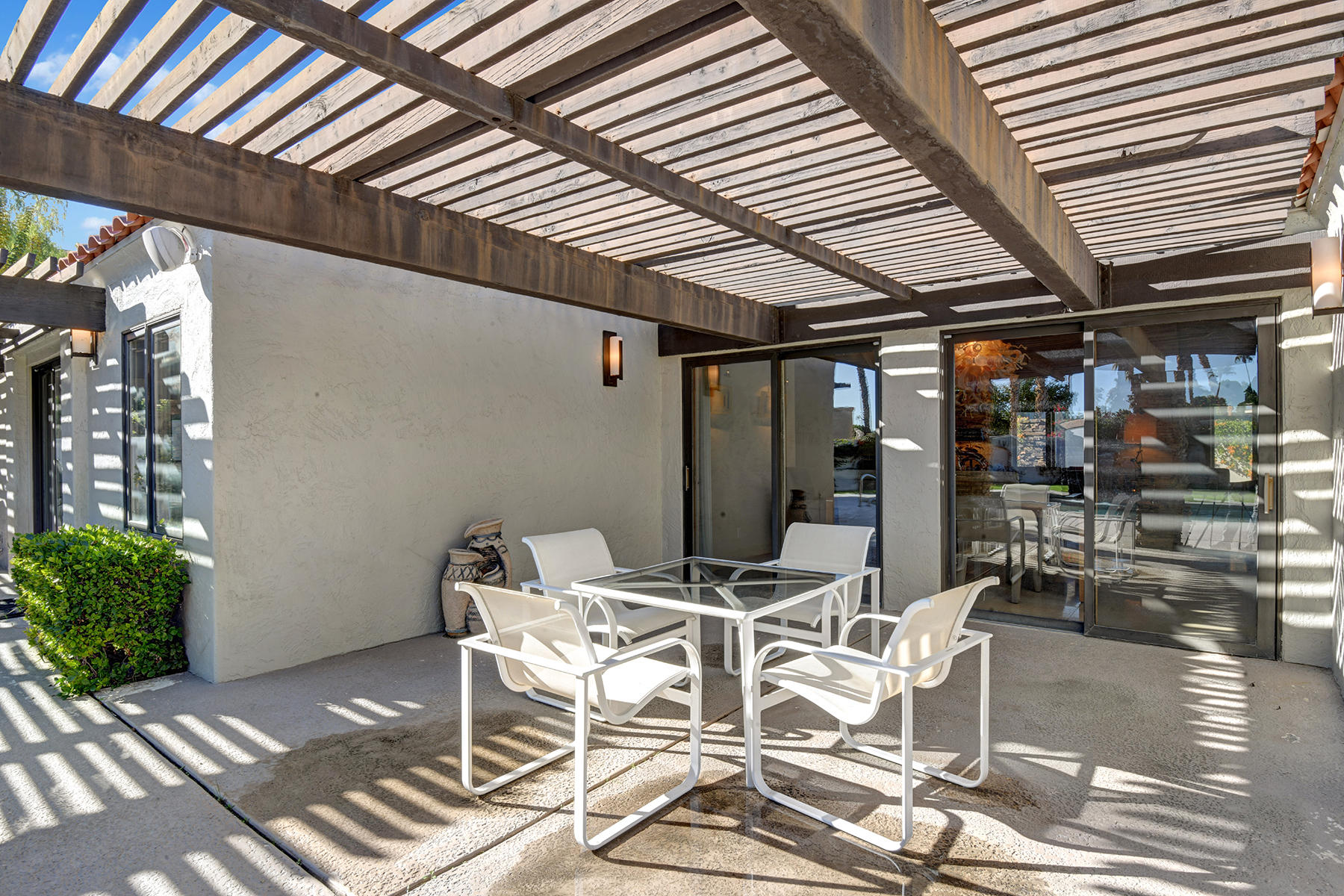 4 Boothill Circle Rancho Mirage, CA 92270 - Photo 10 of 55 a view of a dining room with furniture and wooden floor