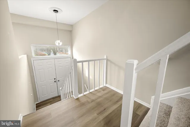 a view of a kitchen from a hallway