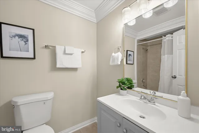 a bathroom with a sink mirror and toilet