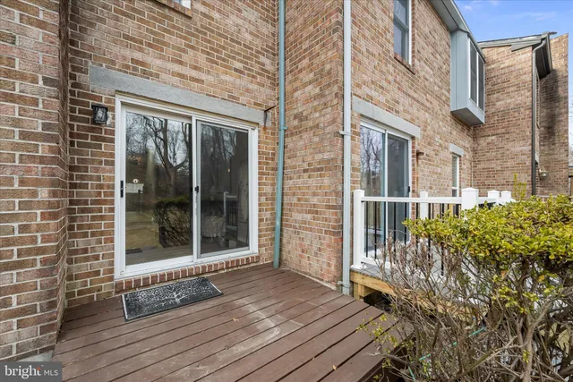 a view of a brick house with a large window