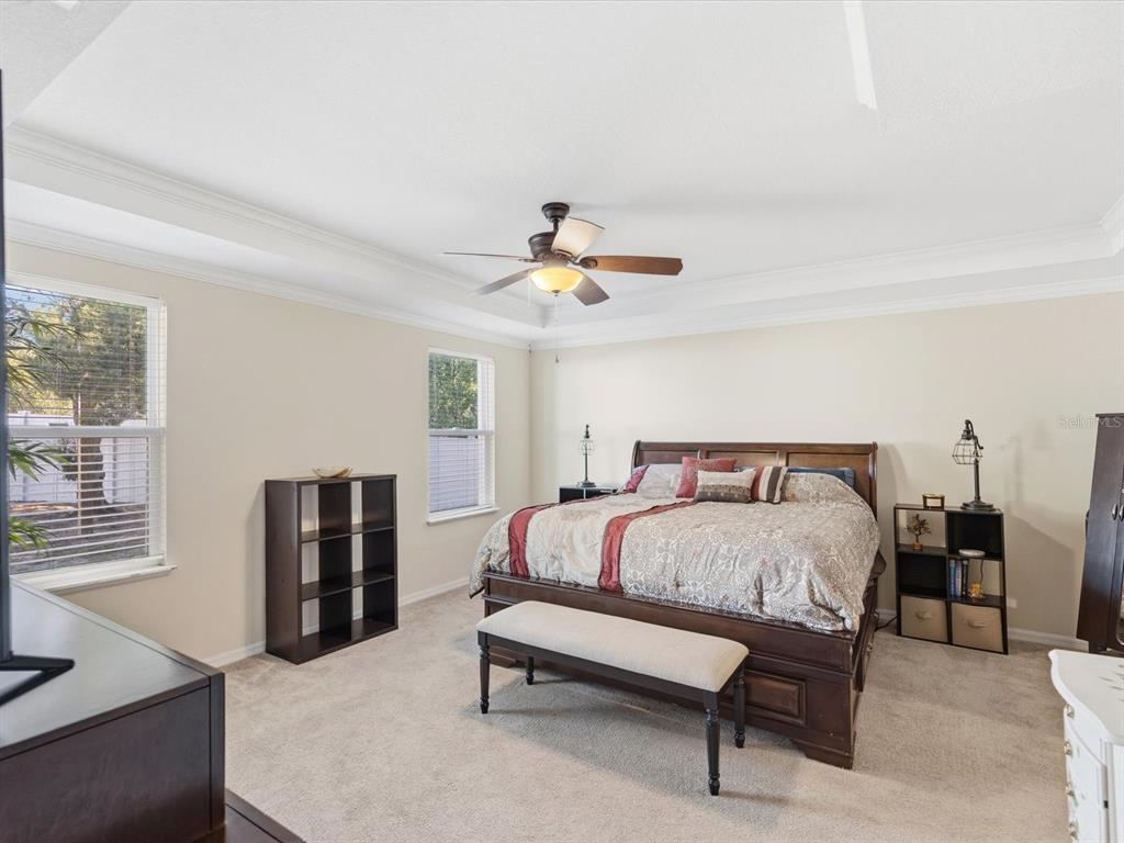 13169 Santee Street Spring Hill, FL 34609 - Photo 25 of 58 a bedroom with a bed and wooden floor