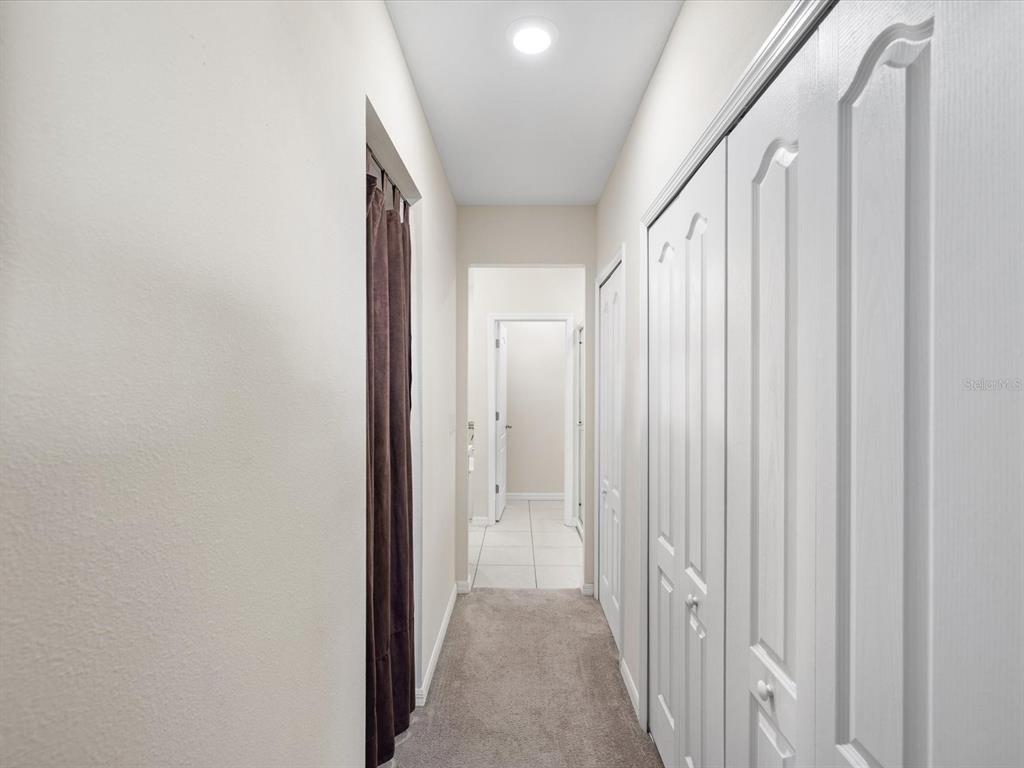 13169 Santee Street Spring Hill, FL 34609 - Photo 27 of 58 a view of a hallway with wooden floor and entryway