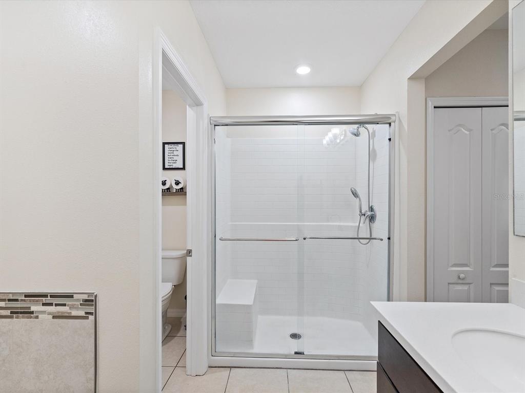 13169 Santee Street Spring Hill, FL 34609 - Photo 30 of 58 a bathroom with a shower and a sink