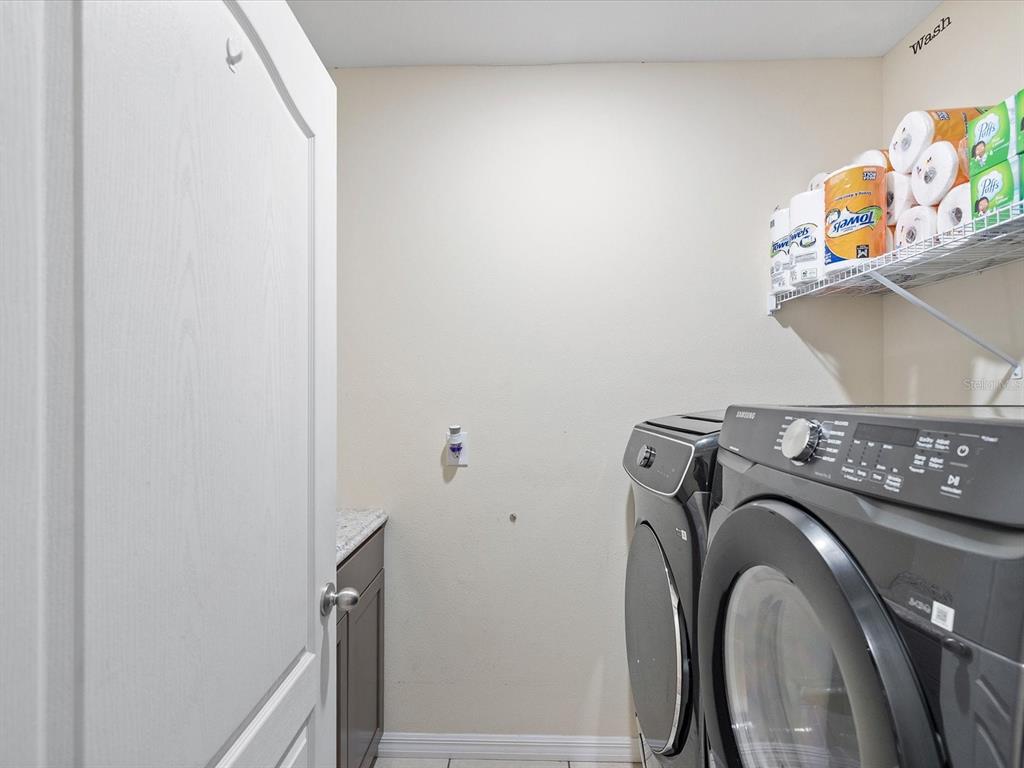 13169 Santee Street Spring Hill, FL 34609 - Photo 33 of 58 a utility room with dryer and washer