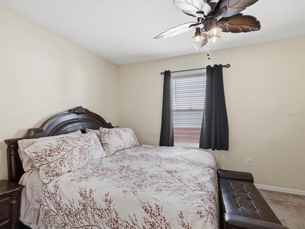13169 Santee Street Spring Hill, FL 34609 - Photo 34 of 58 a bedroom with a bed and a window