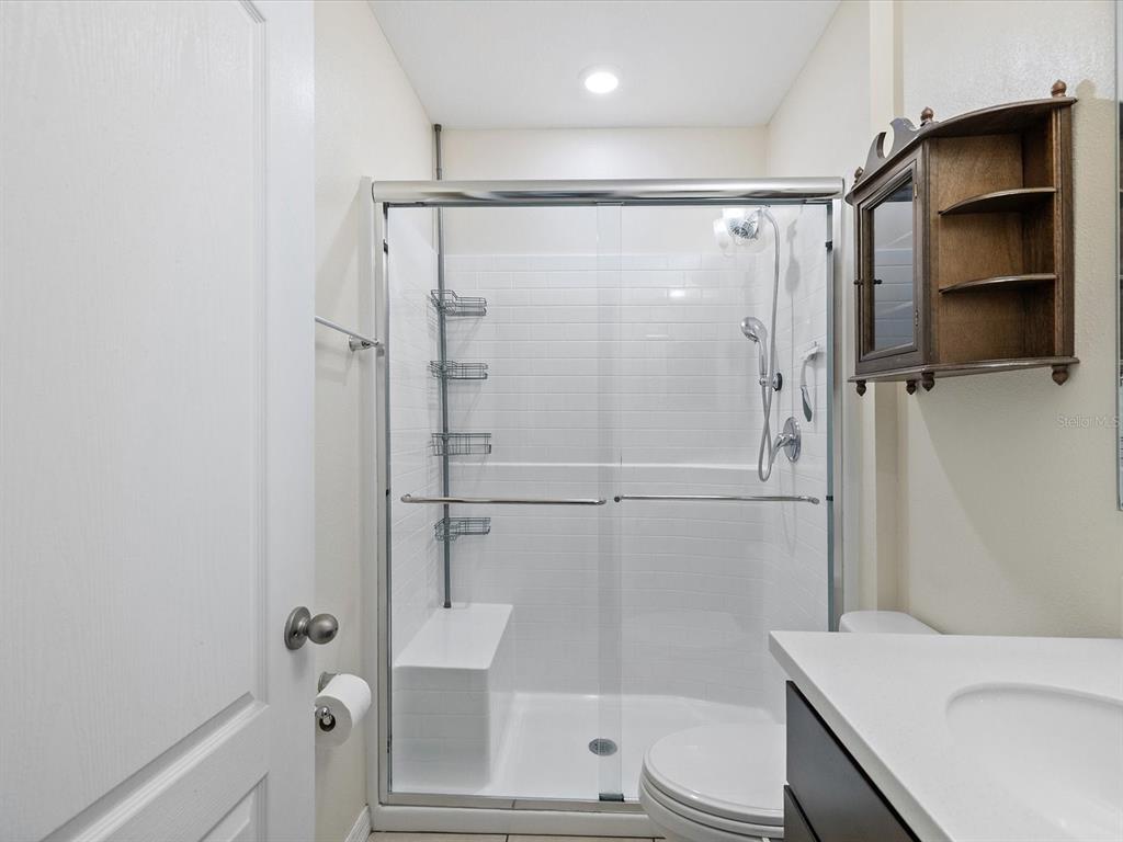 13169 Santee Street Spring Hill, FL 34609 - Photo 36 of 58 a bathroom with a shower and a toilet