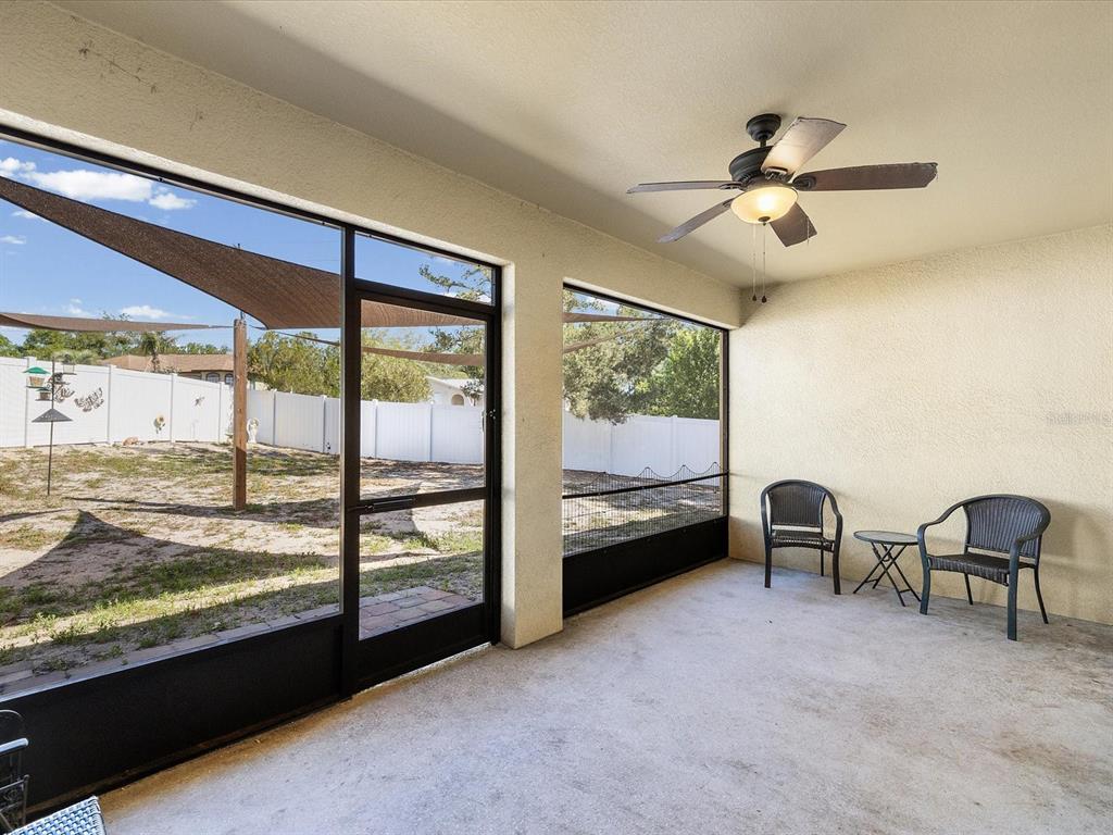 13169 Santee Street Spring Hill, FL 34609 - Photo 38 of 58 a view of a room with window and a ceiling fan