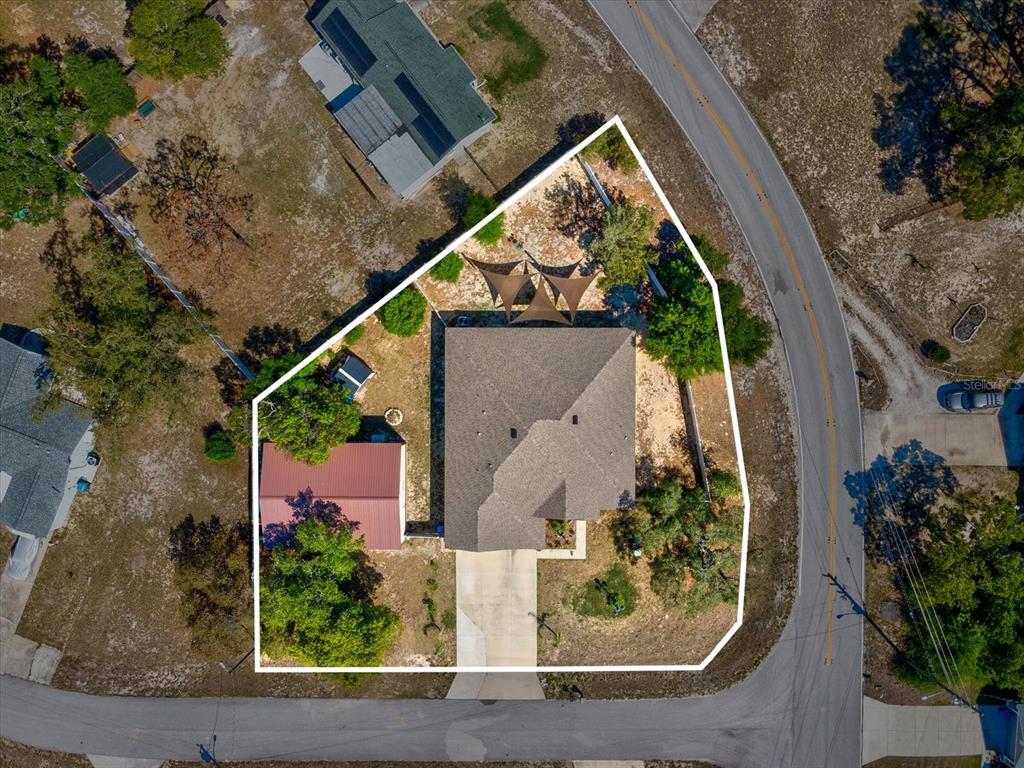 13169 Santee Street Spring Hill, FL 34609 - Photo 4 of 58 an aerial view of a house with a yard and sitting space