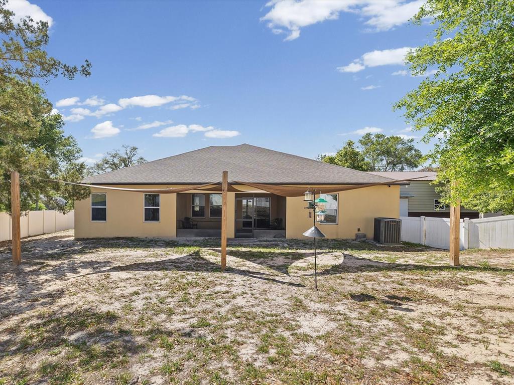 13169 Santee Street Spring Hill, FL 34609 - Photo 41 of 58 a house that has a tree in front of it