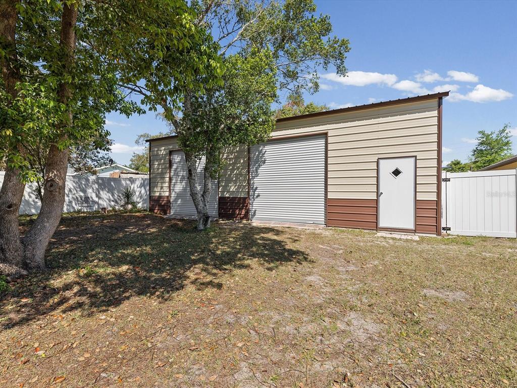 13169 Santee Street Spring Hill, FL 34609 - Photo 44 of 58 a view of a house with a yard