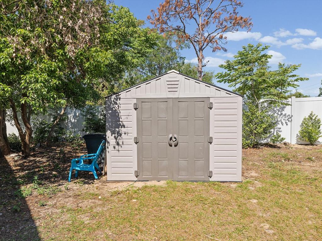 13169 Santee Street Spring Hill, FL 34609 - Photo 46 of 58 a front view of a house with a yard