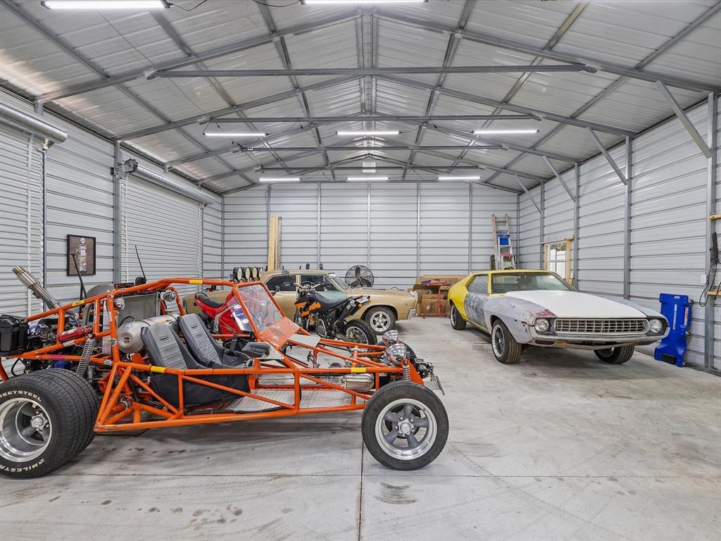13169 Santee Street Spring Hill, FL 34609 - Photo 47 of 58 a view of car parked in a garage