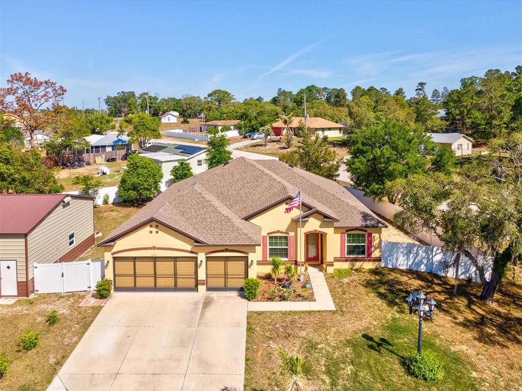 13169 Santee Street Spring Hill, FL 34609 - Photo 52 of 58 a view of house with garden
