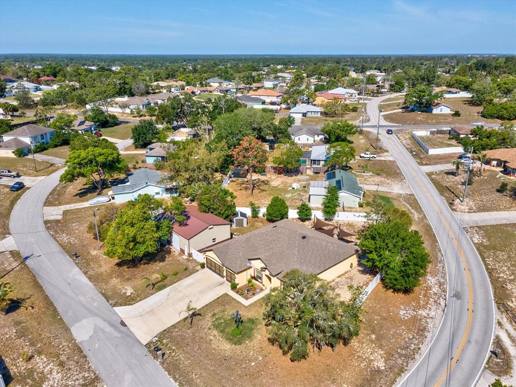 13169 Santee Street Spring Hill, FL 34609 - Photo 58 of 58 an aerial view of residential houses with outdoor space