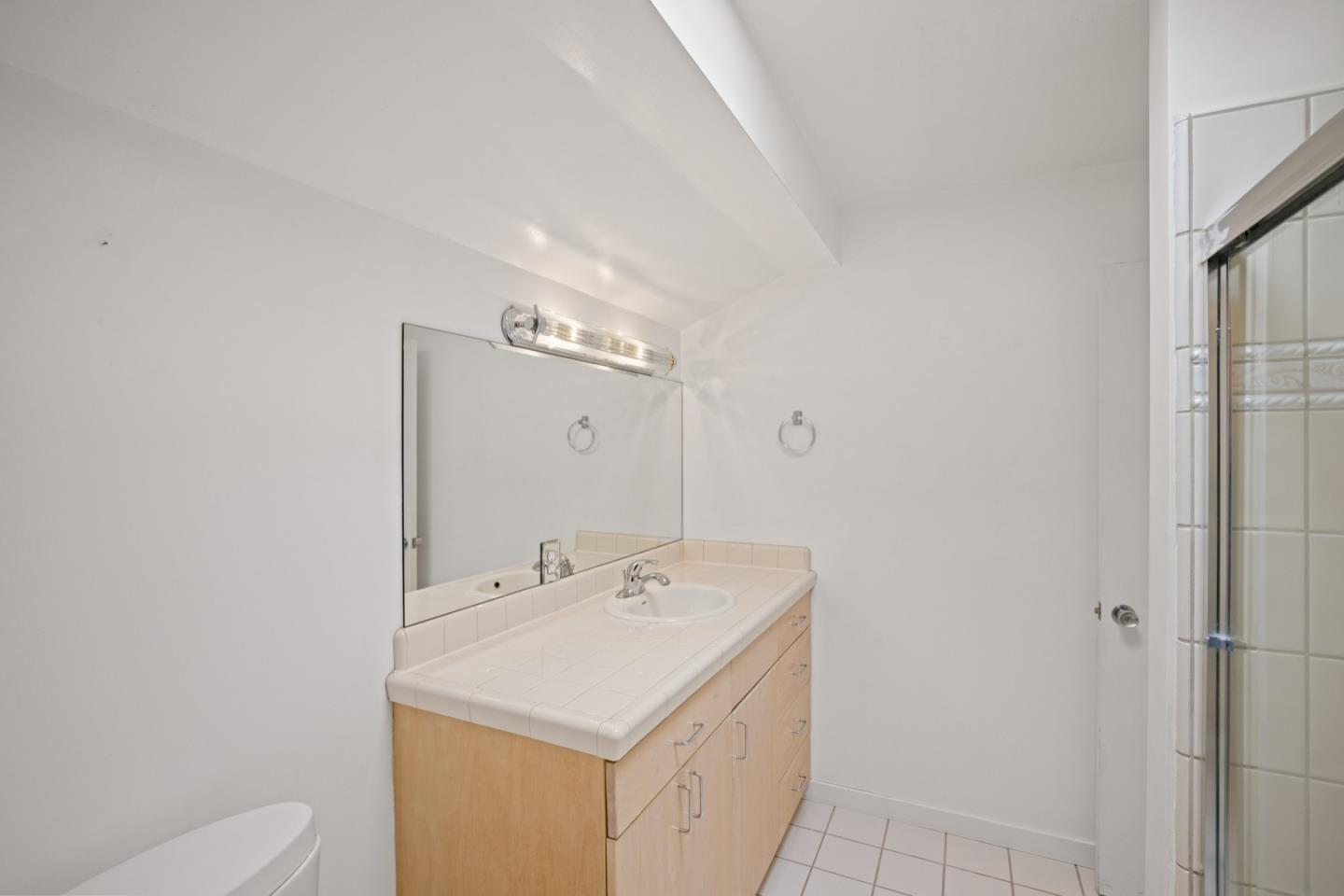 2 Cramden Drive Monterey, CA 93940 - Photo 36 of 50 a bathroom with a sink a toilet and a mirror