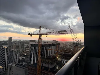 a view of balcony with furniture and city view