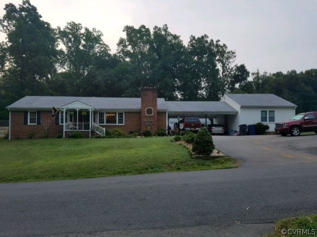 3131 Mountclair Road Chester, VA 23831 - Photo 3 of 23 a front view of a house with a garden and pathway