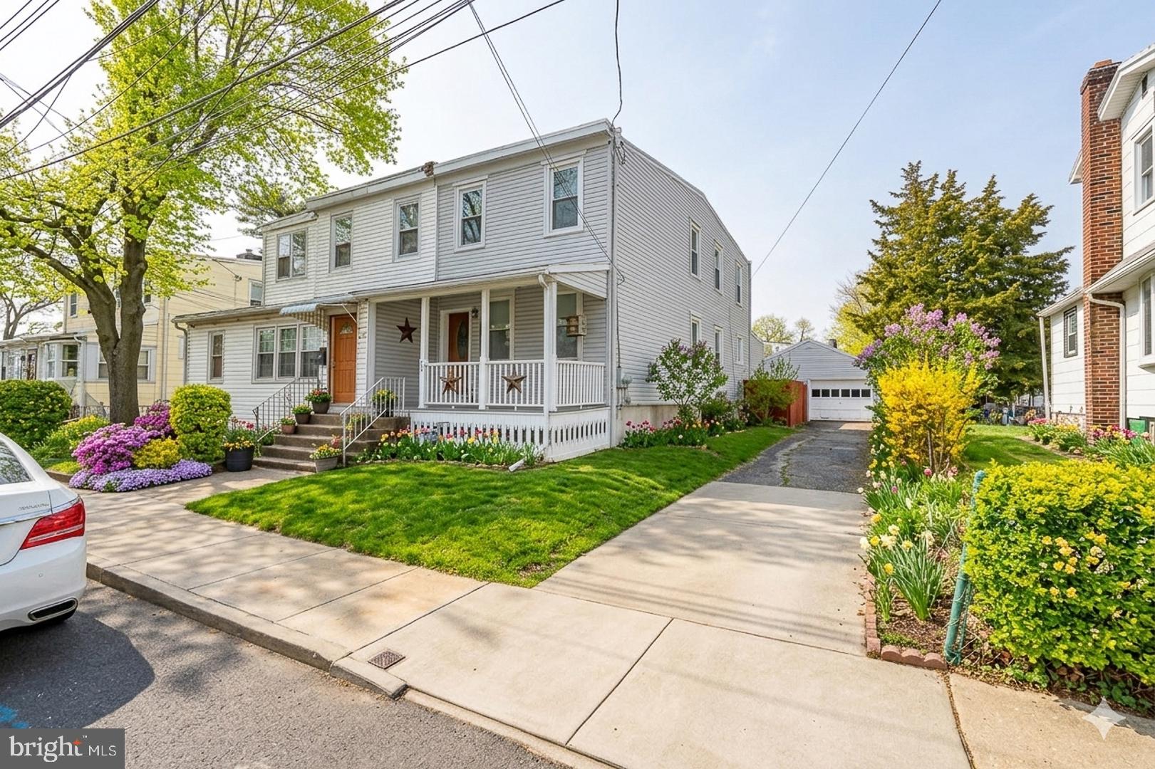 Charming home with vibrant gardens.