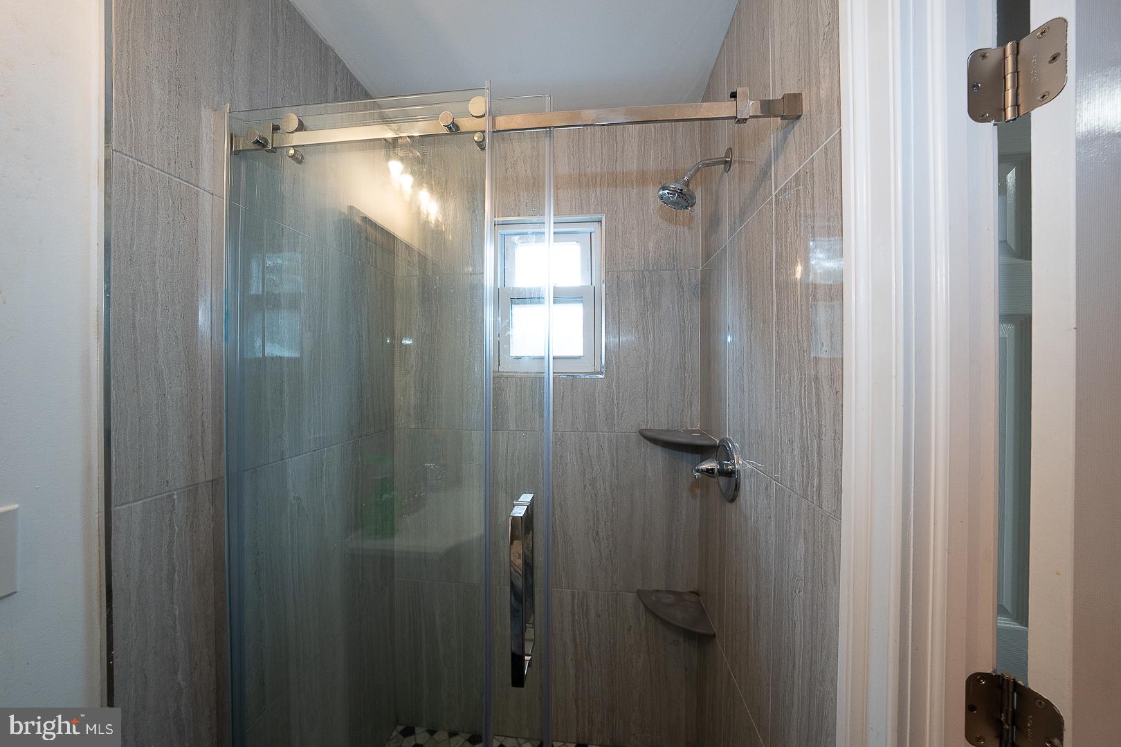 216 Ridley Avenue Sharon Hill, PA 19079 - Photo 11 of 29 Sleek glass shower with modern tiles.