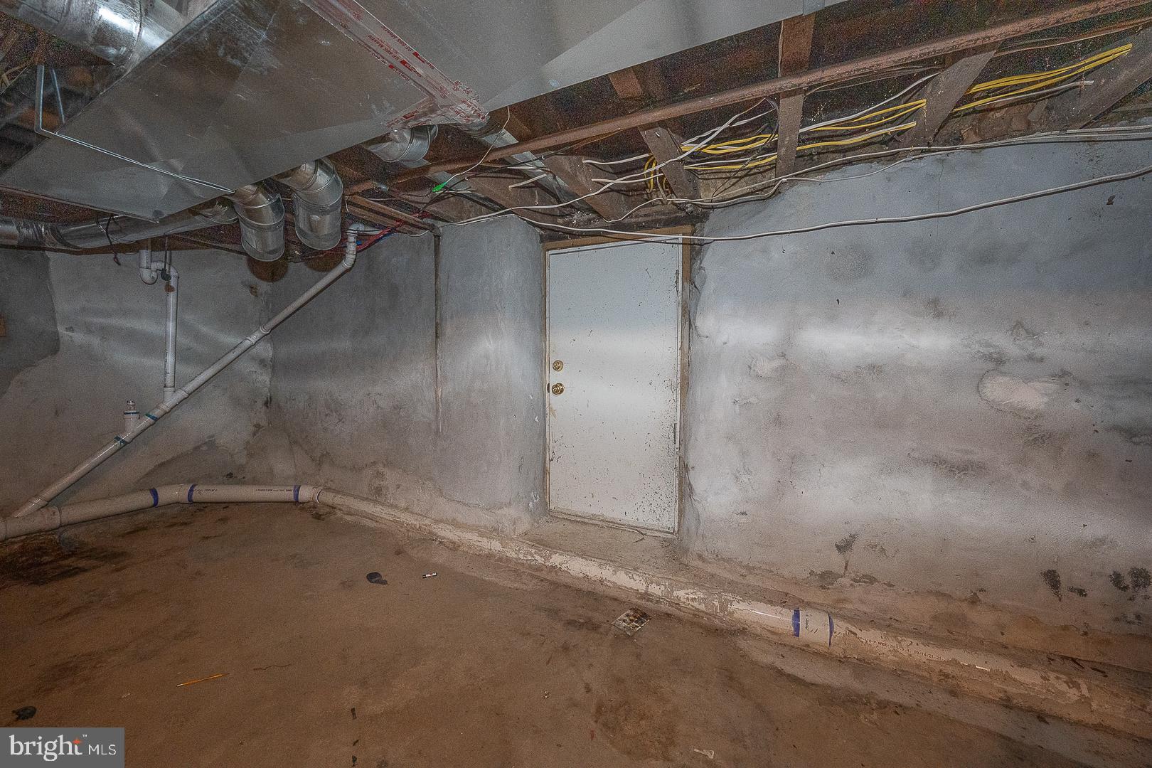 216 Ridley Avenue Sharon Hill, PA 19079 - Photo 28 of 29 Mysterious door in a dimly lit basement.