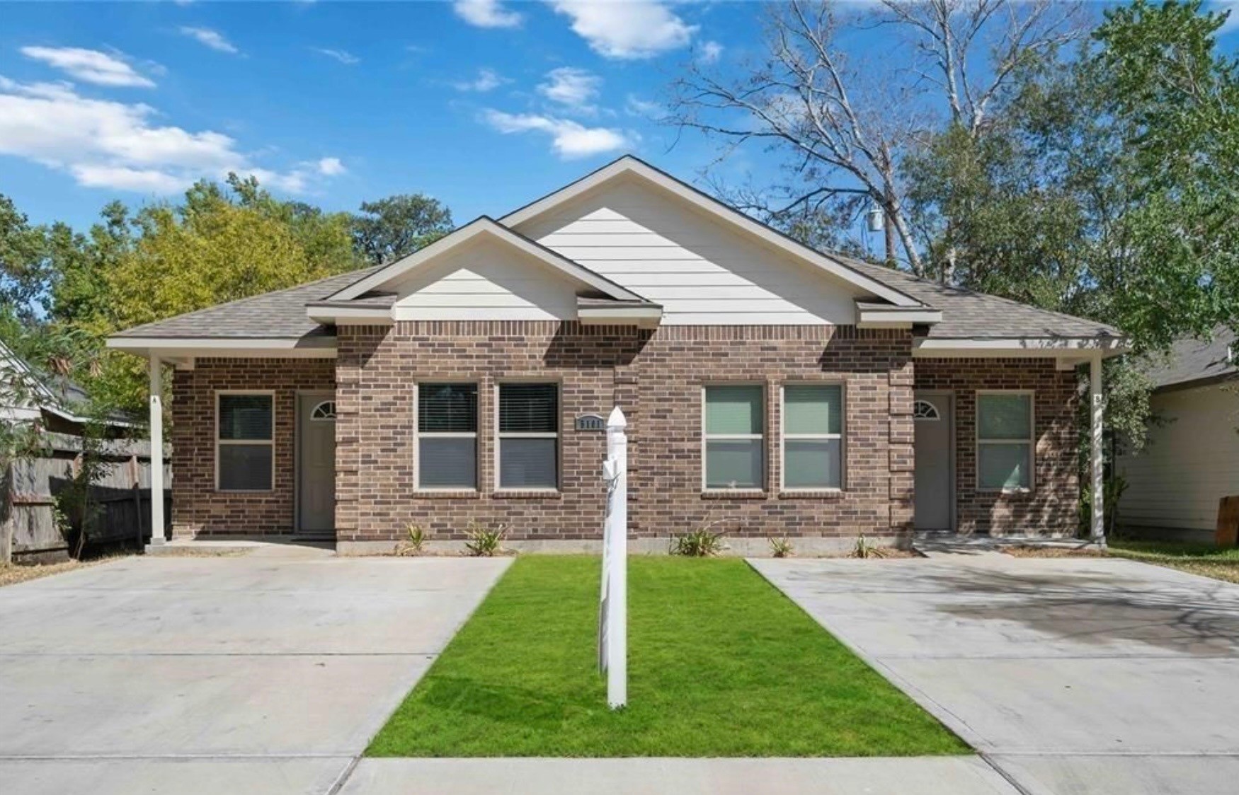 front view of a house with a yard