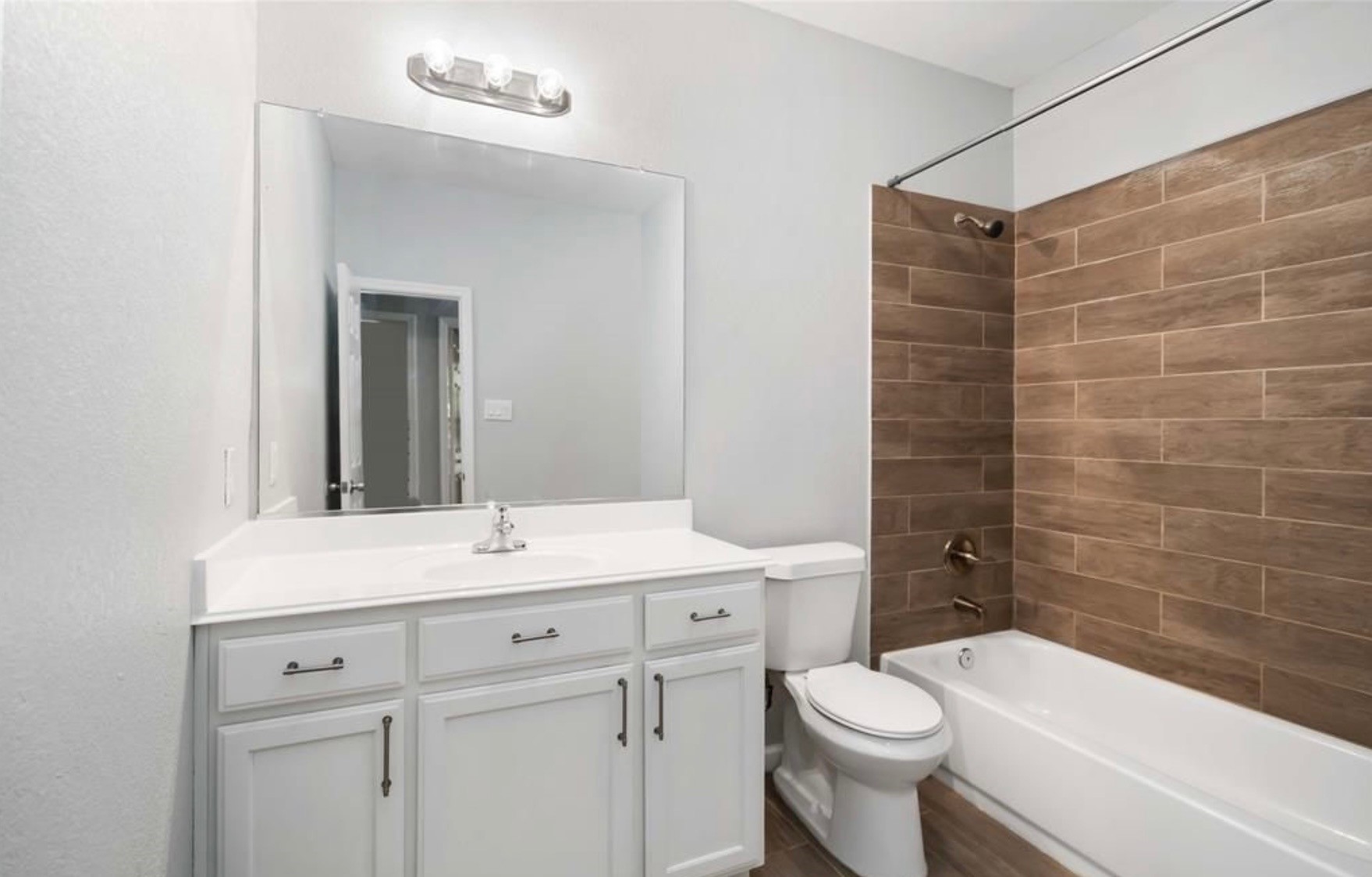 5101 Southwind Street Houston, TX 77033 - Photo 9 of 11 a bathroom with a sink a toilet and shower