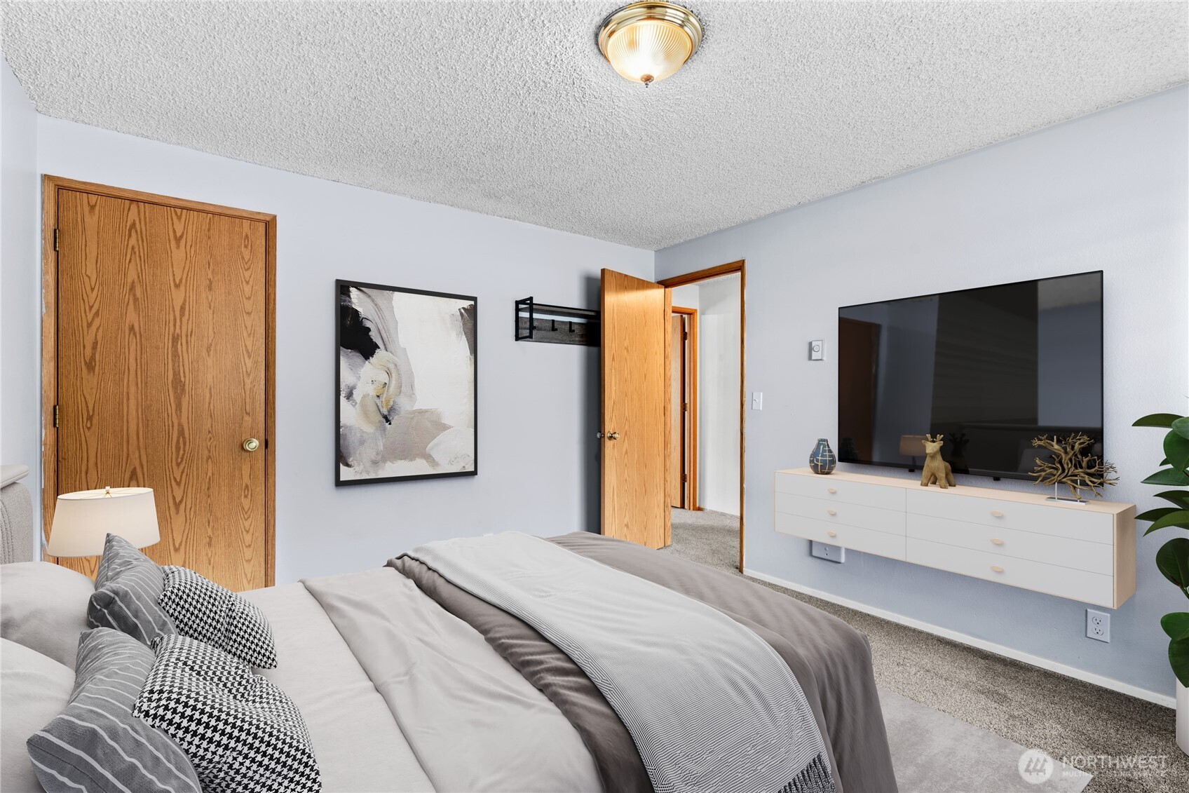 5304 Northeast 84th Loop, Unit 16 Vancouver, WA 98662 - Photo 16 of 22 a bedroom with a bed and a flat screen tv