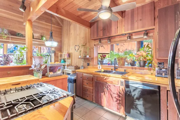 a kitchen with lots of counter top space and wooden floor