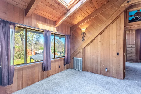 a room with a bed and a dresser