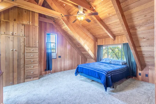 a view of a livingroom with wooden floor and entryway