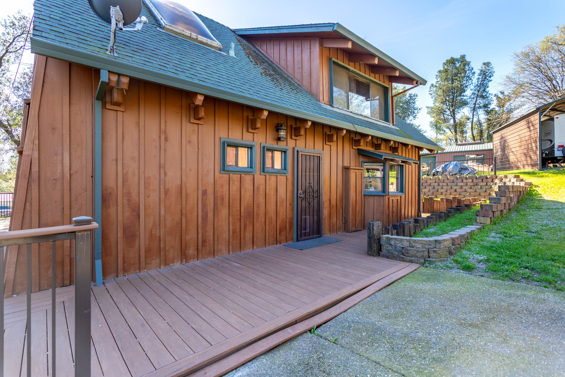 18376 Utility Avenue Anderson, CA 96007 - Photo 31 of 44 a front view of a house with a wooden deck