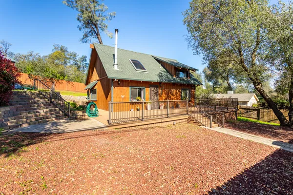 a path view of a house with a swimming pool
