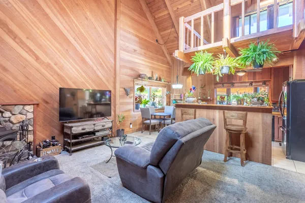 a view of a living room and a flat screen tv